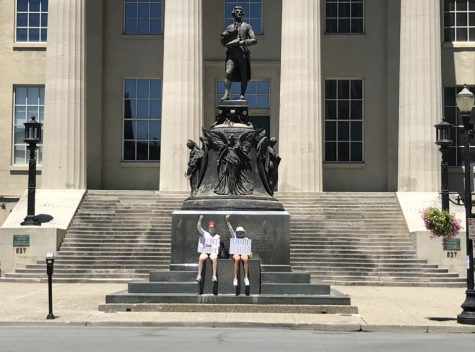 Mackenna Williams (12) and Sarah Burbank (12) protesting downtown.